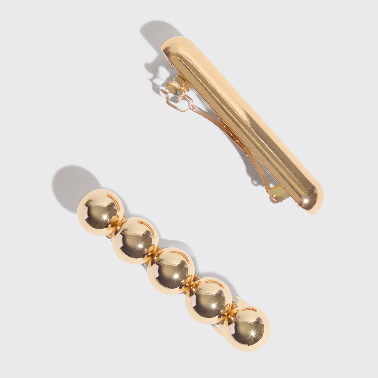 Barrette in metallo dorato