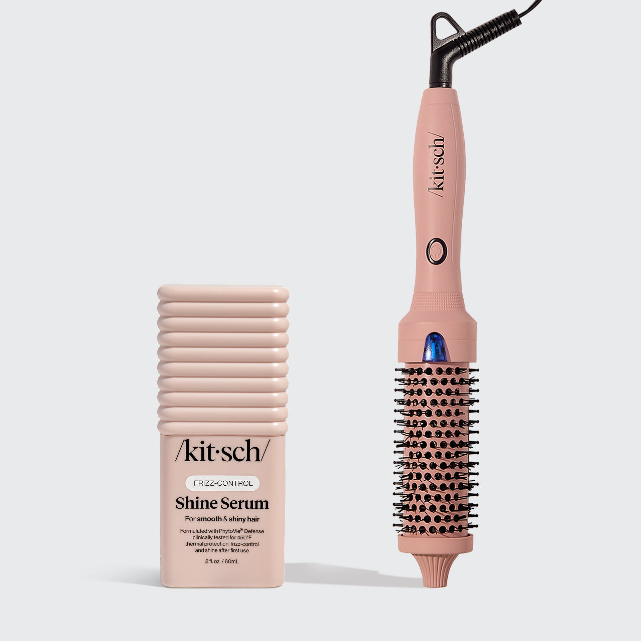 Kitsch's Terracotta Thermal round brush in medium and Kitsch hair serum on a light gray background