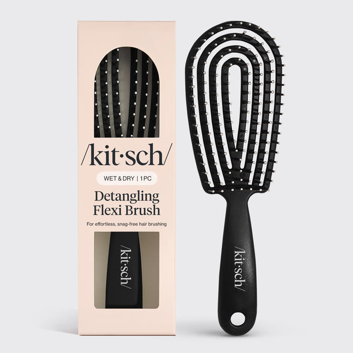 Black Kitsch Detangling Flexi Brush on a soft neutral background – flexible bristles for gentle detangling