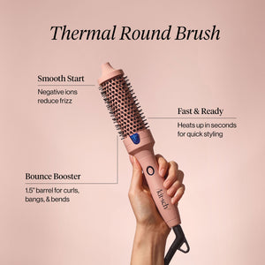 Kitsch thermal round brush held by a hand with features highlighted on a pink background. Features include: Smooth start - negative ions reduce frizz; fast & ready - heats up in seconds for quick styling; bounce booster - 1.5 inch barrel for curls, bangs, and bends.