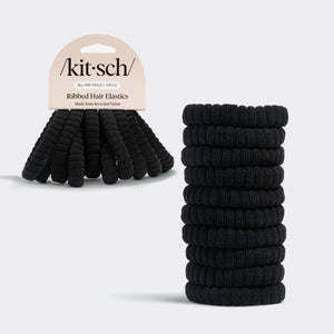 Stack of Kitsch black ribbed hair elastics with 'kit-sch' packaging on a gray background