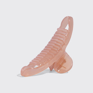 Kitsch Side view of translucent Soft Pink Arched Claw Clip - Large showing curved teeth and hinge