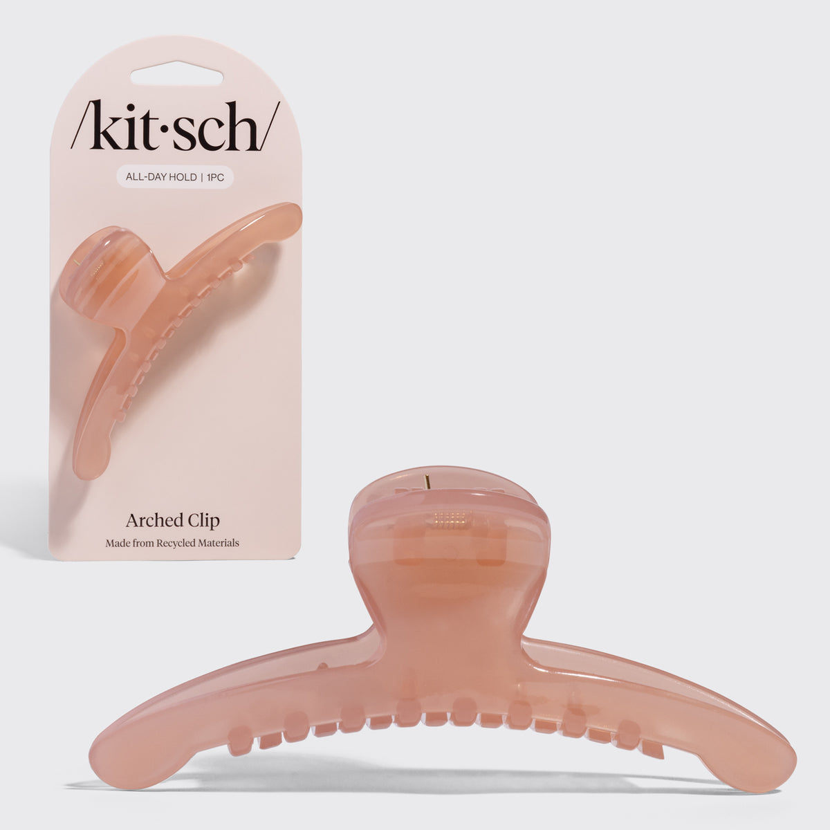 Kitsch Translucent Soft Pink Arched Claw Clip - Large shown with pink Kitsch packaging and front view