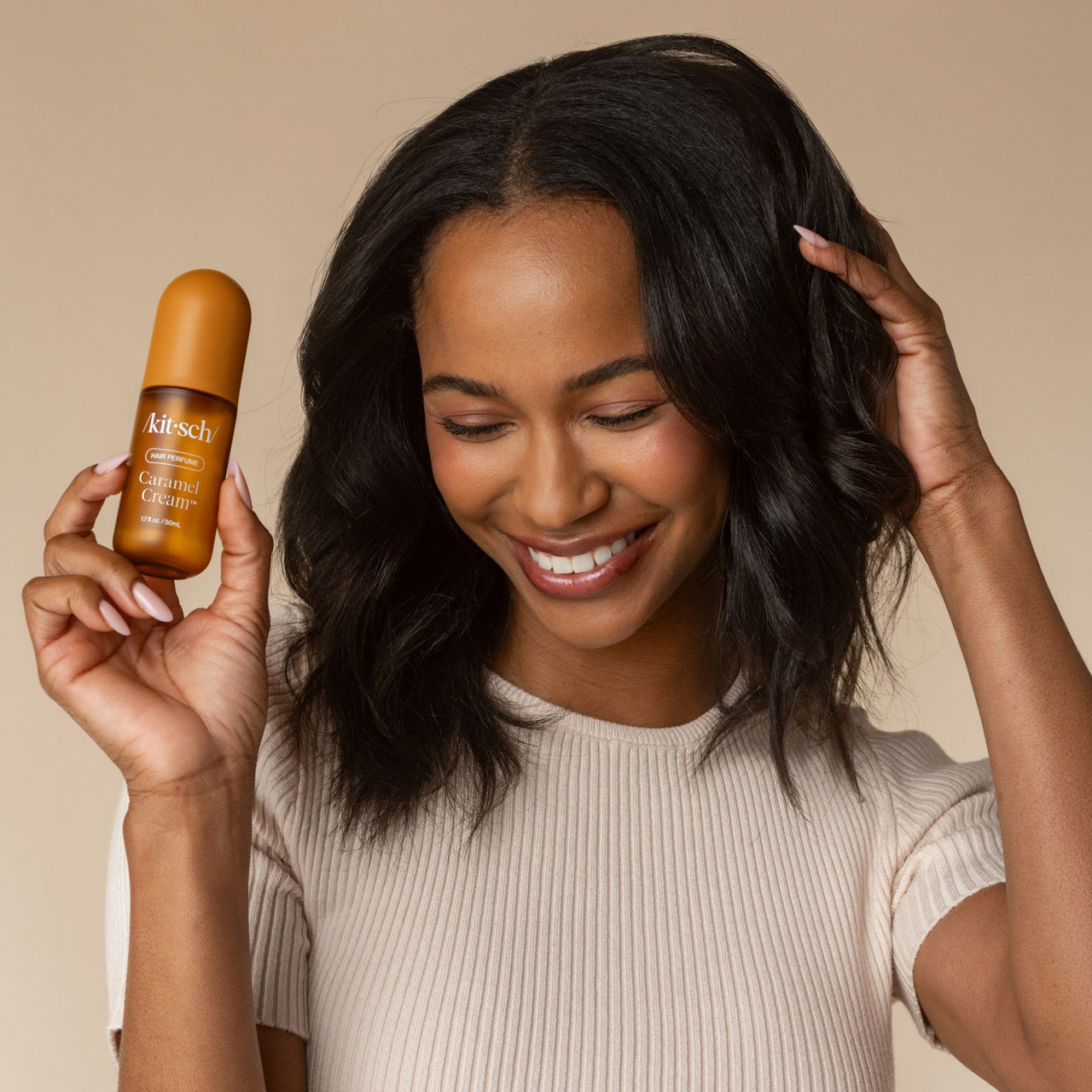 Model using Kitsch Caramel Cream Hair & Body Perfume Mist
