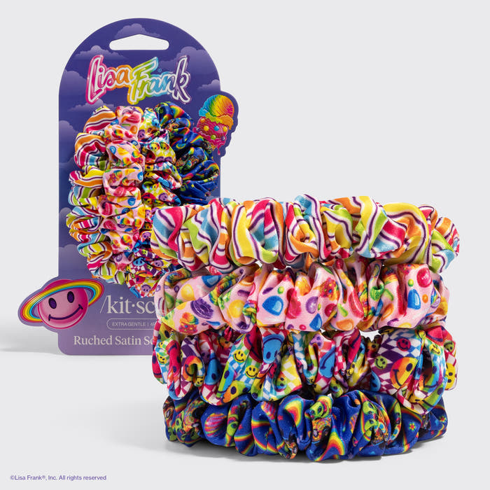 KITSCH Lisa Frank x Kitsch Ruched Satin Scrunchies in Fantastic World of Lisa Frank — four ruched satin scrunchies in rainbow Lisa Frank prints stacked in front of their purple card packaging — vibrant, playful designs, gentle, snag-free hold — soft alternative to traditional elastics for ponytails, braids, or buns