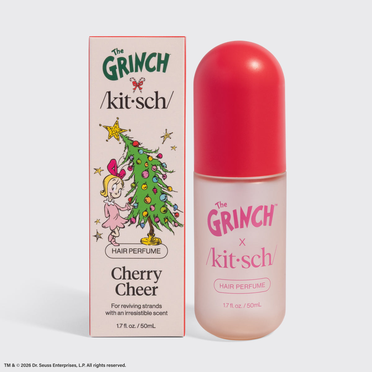 The Grinch x Kitsch Cherry Cheer Hair Perfume 1.7 fl oz bottle next to its Cindy-Lou Who box