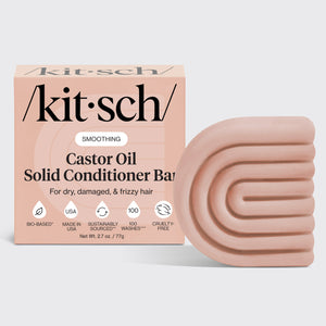 KITSCH Castor Oil Nourishing Conditioner Bar — hero product shot on light gray background — SMOOTHING Castor Oil Solid Conditioner Bar retail box with bar — For dry, damaged, & frizzy hair — Bio-based | Made in USA | Sustainably Sourced | 100 Washes | Cruelty-Free — Net Wt. 2.7 oz / 77g — Infused with castor oil to help restore moisture and maintain healthy, healed ends