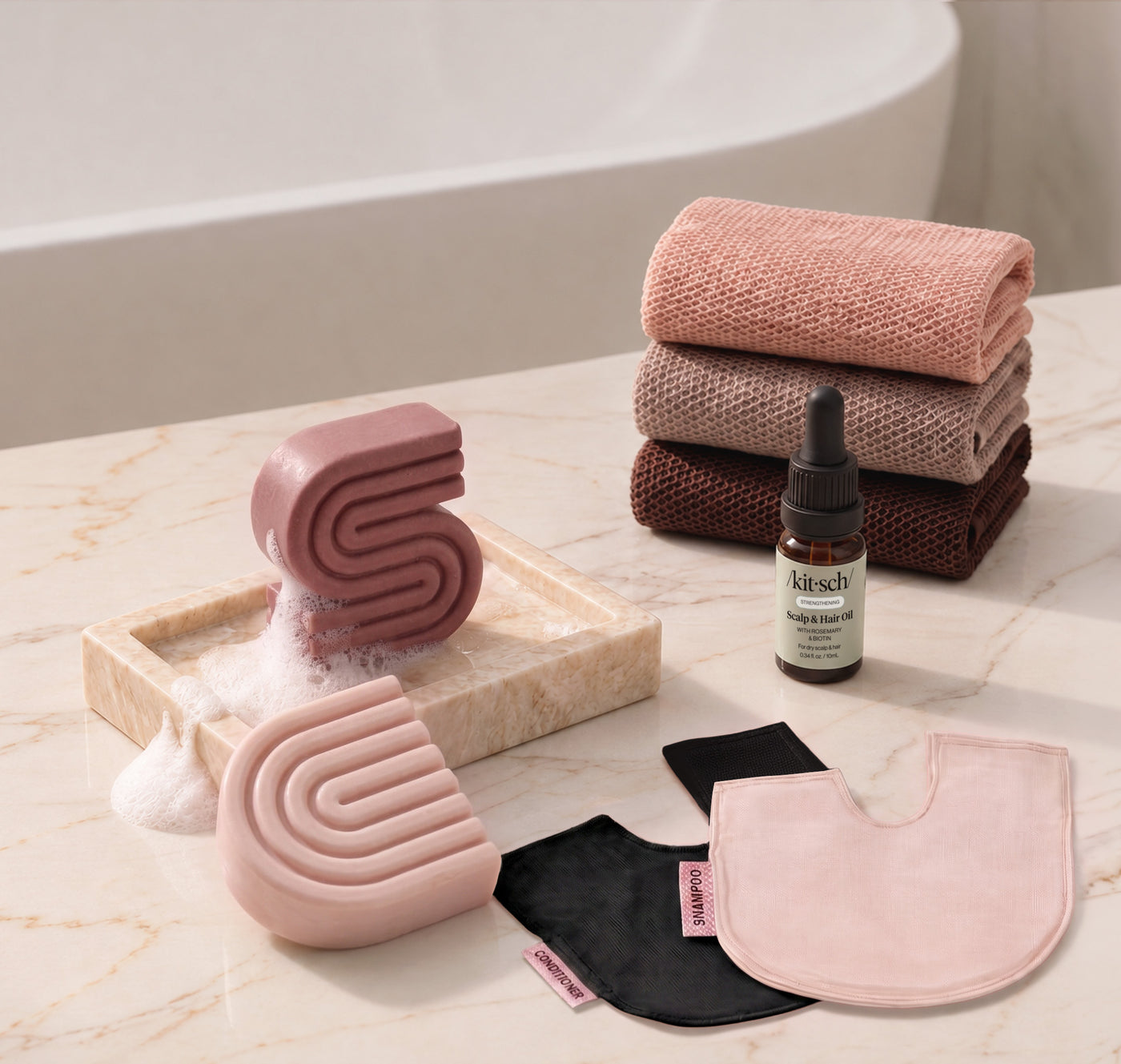 Castor Oil: Kitsch Winter Welcome Kit with Castor Oil shampoo and conditioner bars, Rosewood African Net Sponge, shampoo and conditioner bar bags, and Rosemary & Biotin Scalp & Hair Oil.