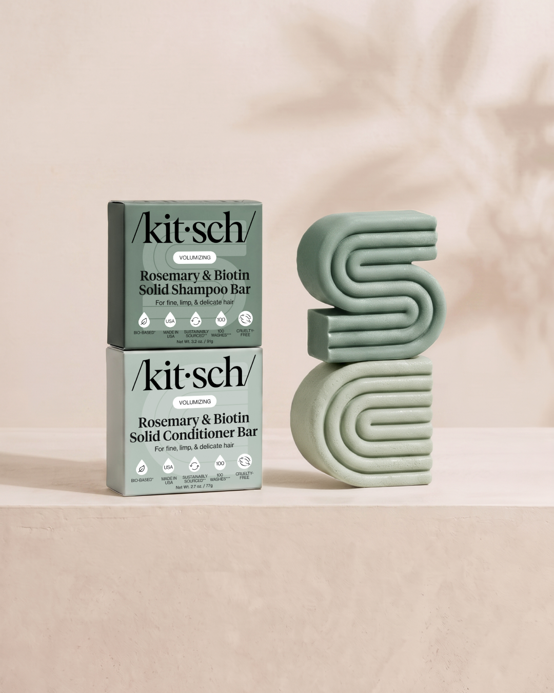 Kitsch Volumizing Rosemary & Biotin Solid Shampoo and Conditioner Bars shown side by side with retail packaging – clinically proven to thicken hair, for fine, limp and thinning hair